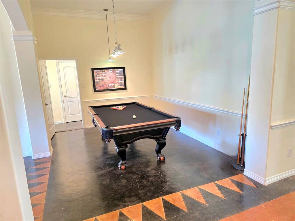The owners are currently using the dining room for their pool table.
