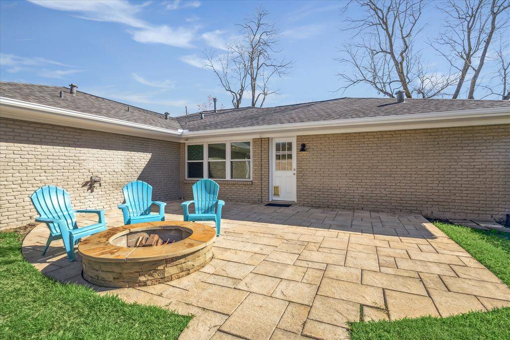 A spacious backyard patio with a cozy fire pit perfect for outdoor relaxation and entertaining with room for outdoor kitchen. Enjoy the wide open western Texas sky sunsets from this corner lot.