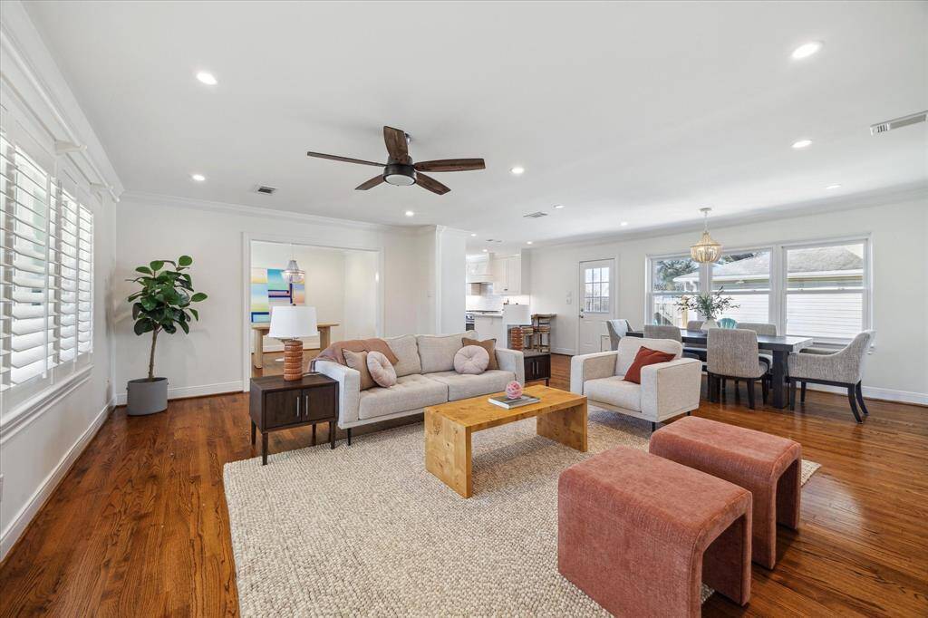 View from front entry. Great living room with ample amounts of natural light from windows, upgraded throughout the house to energy efficient triple-pane windows. Dining area could also be used as flex playroom space.