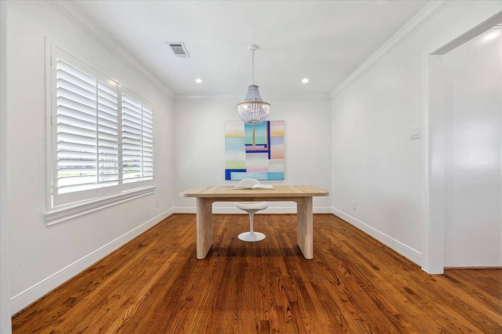 Home office or formal dining room with plantation shutters, recessed lighting and custom crown molding. Large enough for full size dining table.