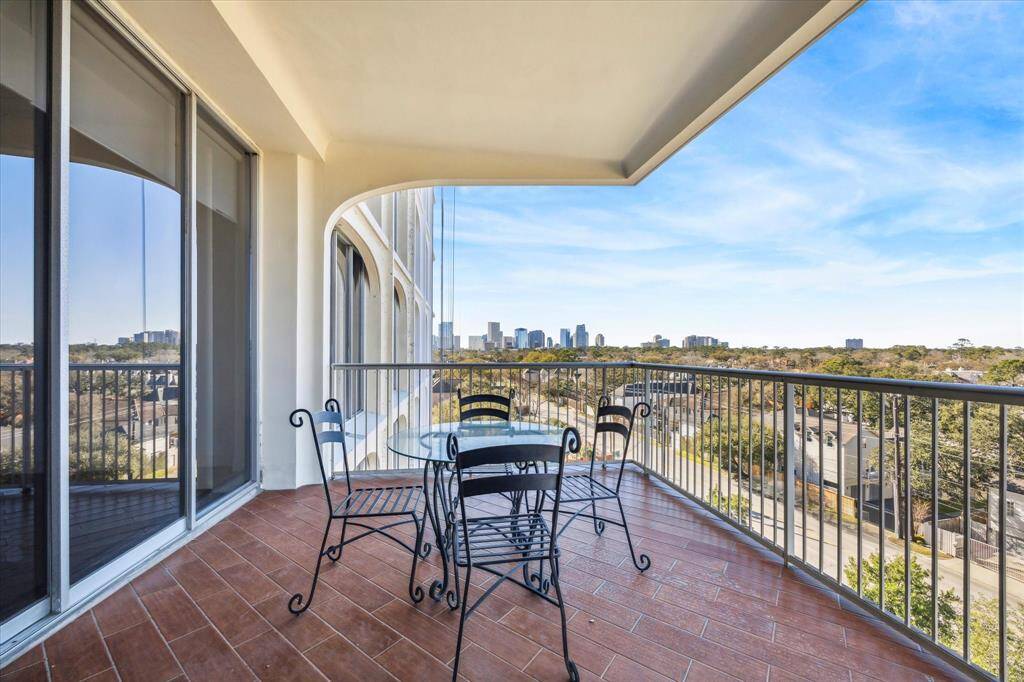 The balcony can be access through the living room or bedroom.