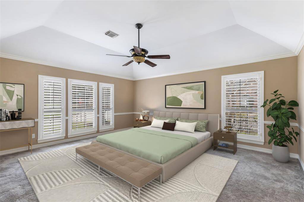 Primary bedroom also has custom plantation shutters