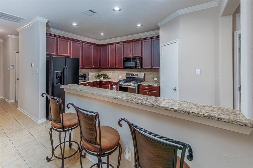 Expansive breakfast bar provides additional seating