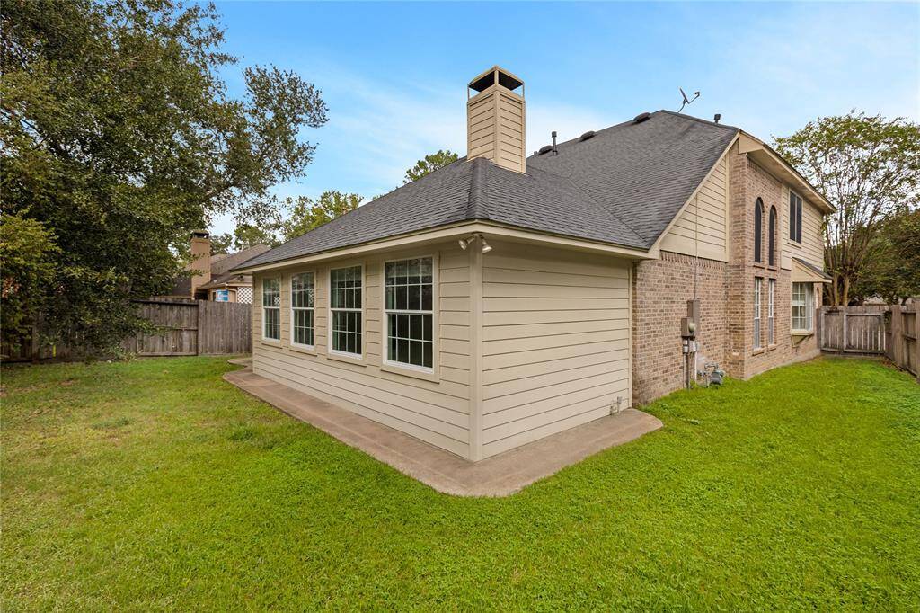 A well-maintained lawn and a fenced backyard, offering privacy and outdoor space.