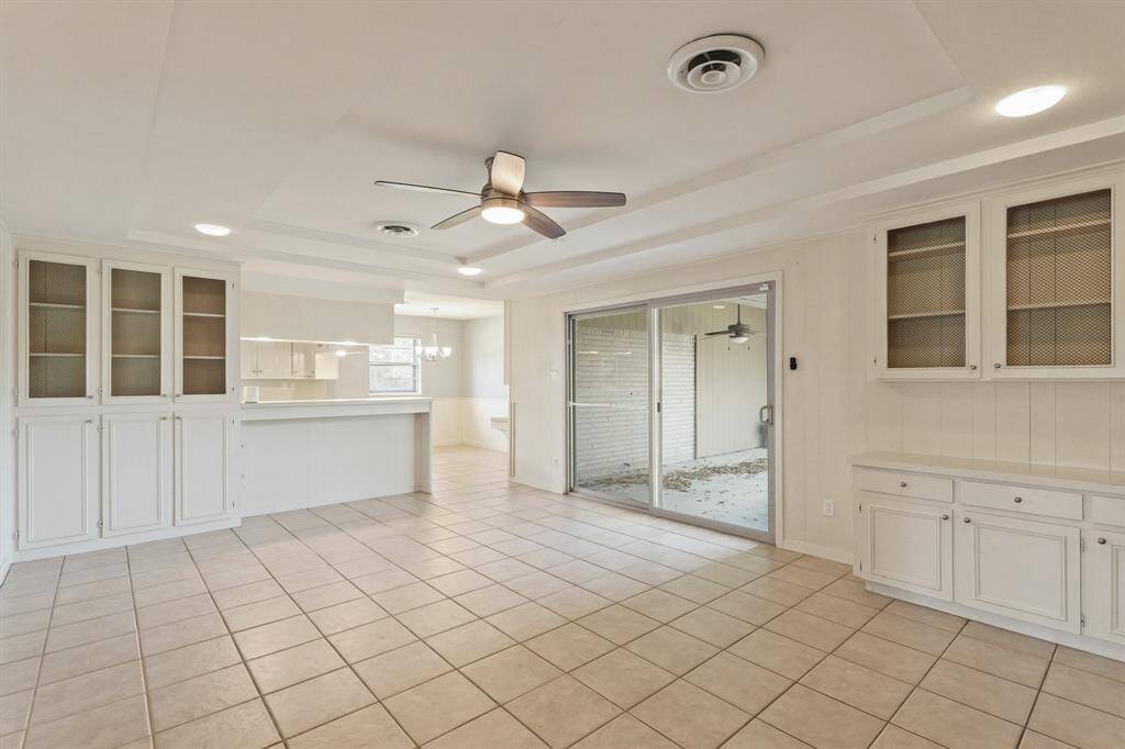 Den looking toward kitchen and breakfast areas