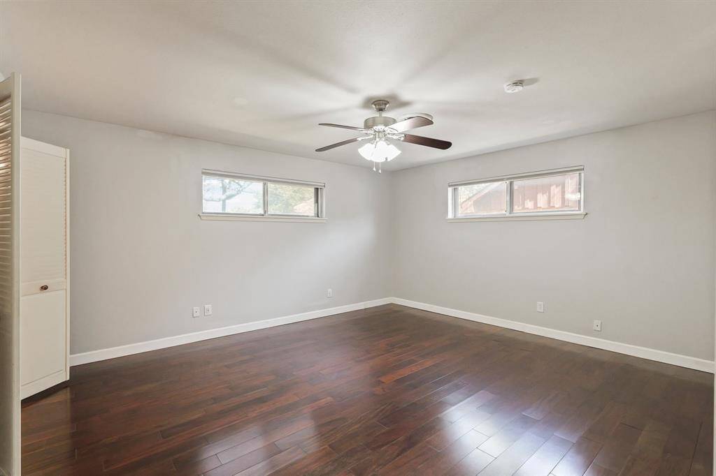 Spacious Primary Bedroom! Featuring updated flooring, fresh paint, and plenty of natural light, this room is a perfect retreat.