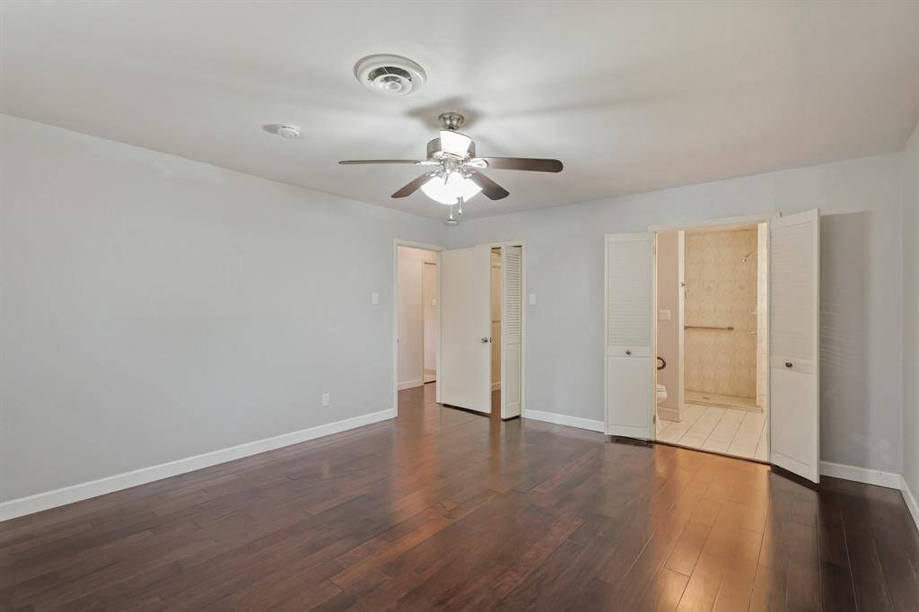 Primary Bedroom with En-Suite Bath! Enjoy privacy in this large bedroom with direct access to an updated bathroom and a walk-in closet.