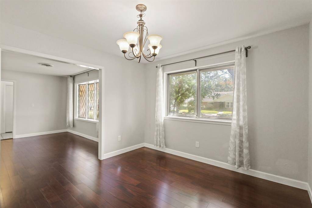Formal Dining and formal living rooms at the front of the home with beautiful recent flooring and updated lighting.
