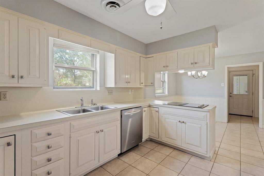 Kitchen open to breakfast area showing great natural lighting and open space for entertaining.