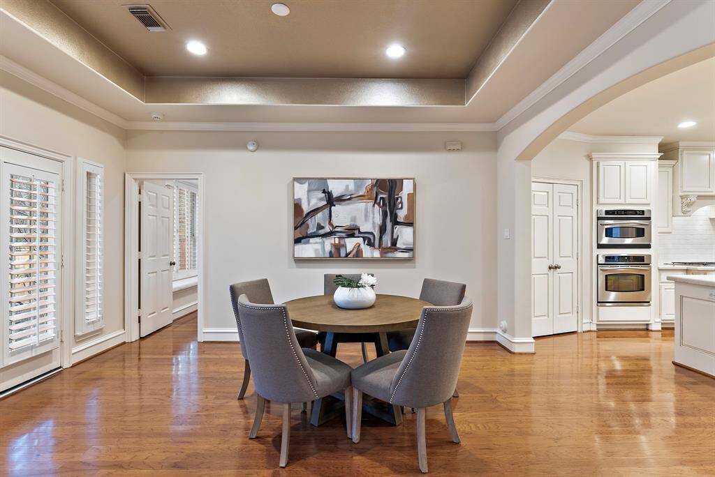 The breakfast area offers a casual dining space with natural light and easy access to outside.