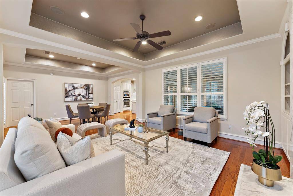 The open layout flows seamlessly into the breakfast area and kitchen, creating an inviting space perfect for both relaxation and entertaining.