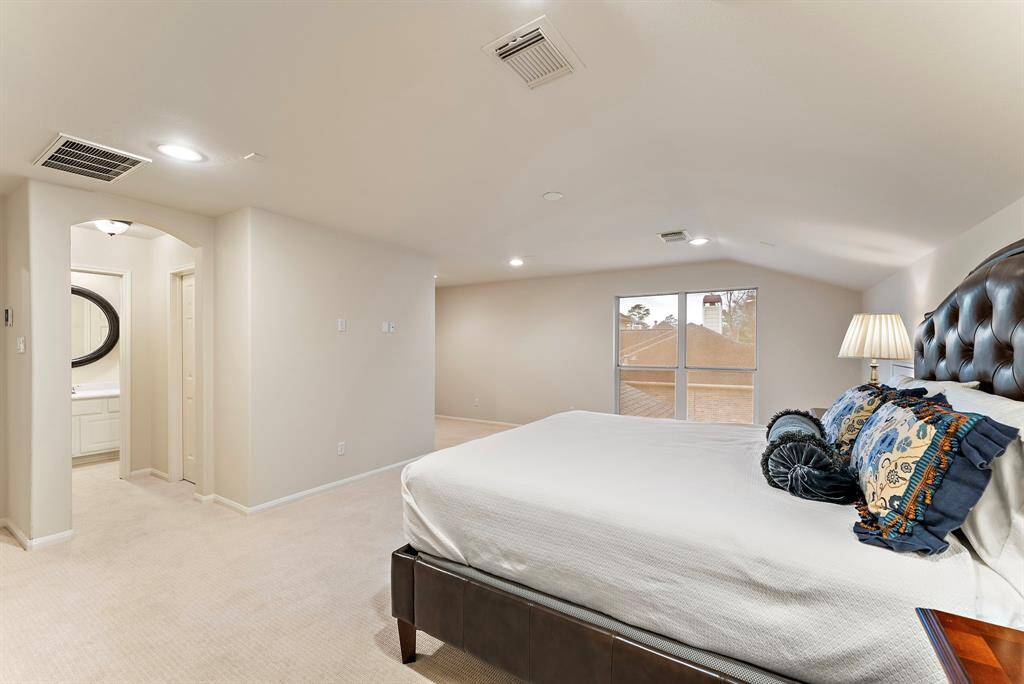 Conveniently designed, this secondary primary suite features an ensuite bath, offering guests additional comfort and privacy.