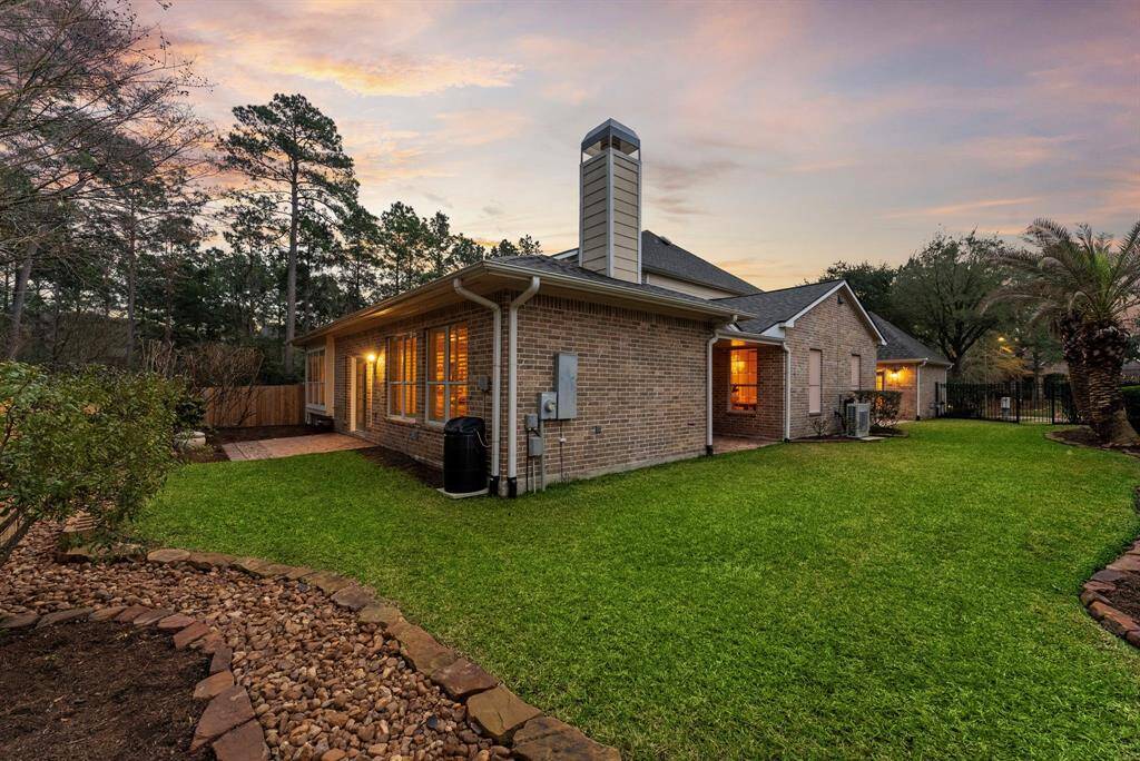 Brick exterior harmonizes beautifully with the lush, spacious backyard, offering endless opportunities for outdoor enjoyment and gatherings.