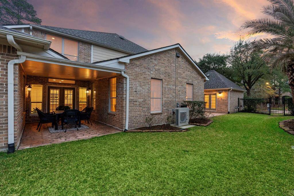 The Covered patio seamlessly blends indoor comforts with outdoor charm, perfect for intimate dinners or relaxing evenings overlooking the private backyard.