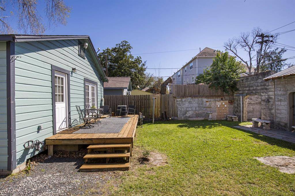 Spacious wood deck with stunning views of the backyard and garden.
