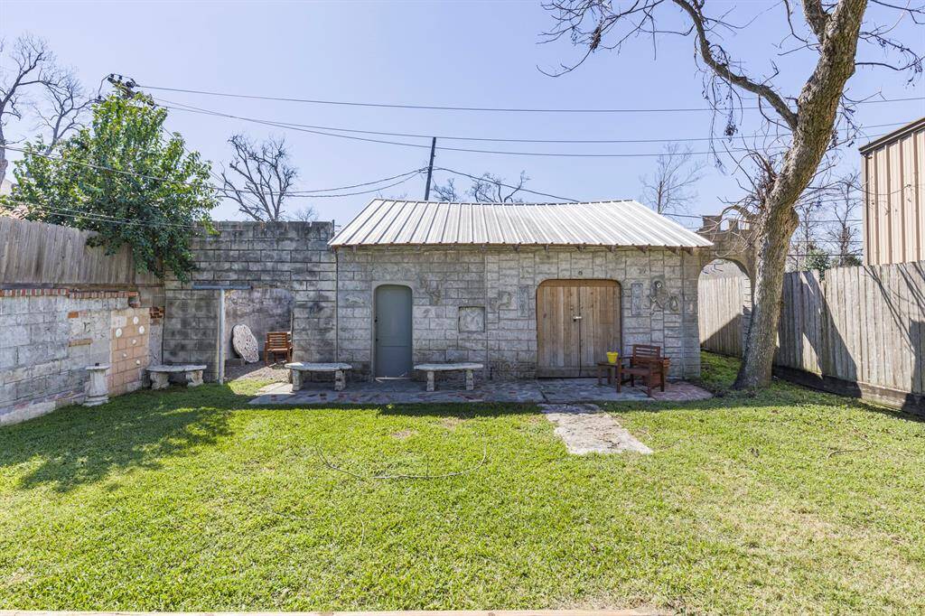 Spacious garage with an attached workroom for projects and storage.