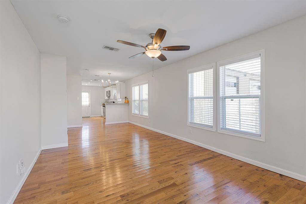 Spacious living area has woodfloors throughout