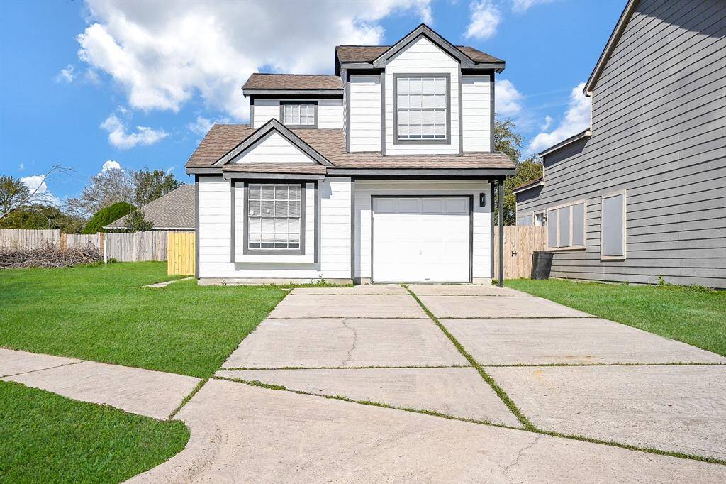 Welcome to your new home! This charming two-story home boasts a modern design with a crisp white exterior.
