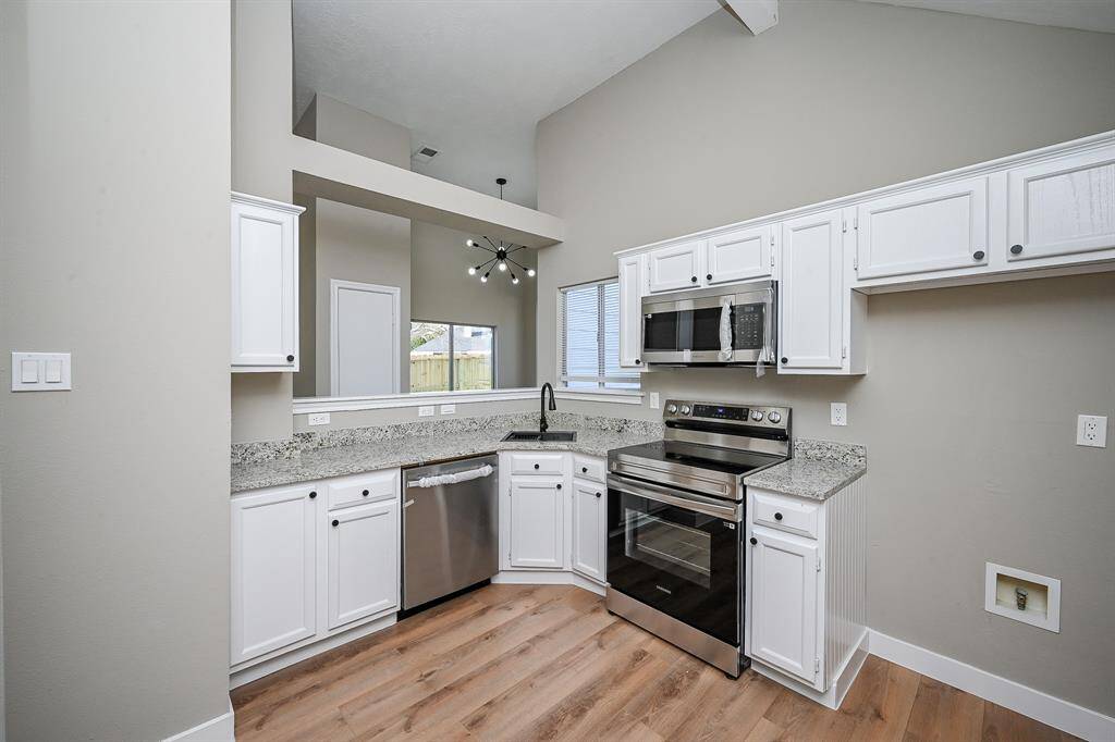 Step into this comfortable bedroom that offers ample natural light.