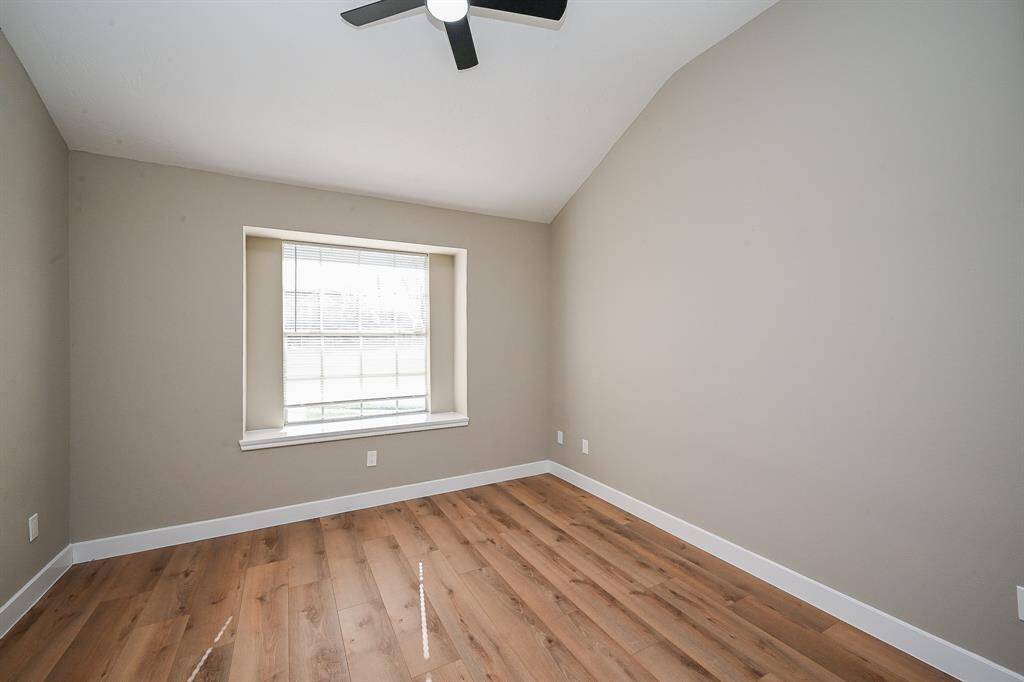This property features a private fenced backyard with a well-maintained lawn, perfect for outdoor enjoyment.