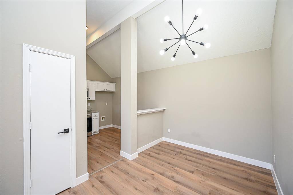 Step into this bright, airy dining space with soaring vaulted ceilings and a unique architectural design.
