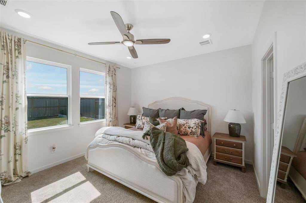 Primary Bedroom has large windows for natural light.