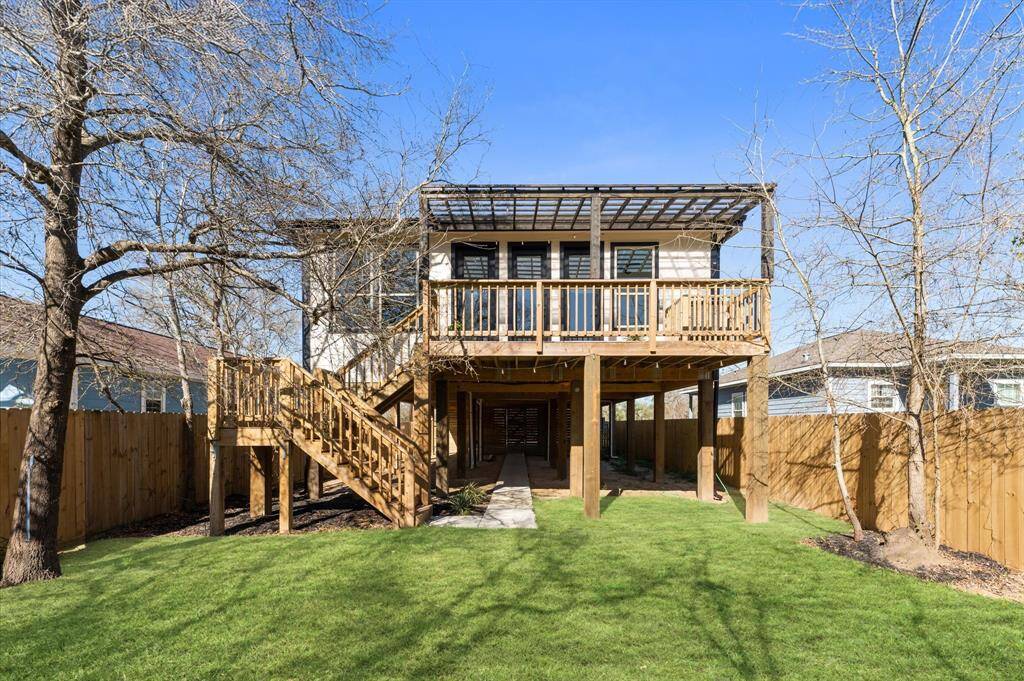 Enjoy shaded outdoor living with a spacious patio area perfect for dining, lounging, or entertaining guests.