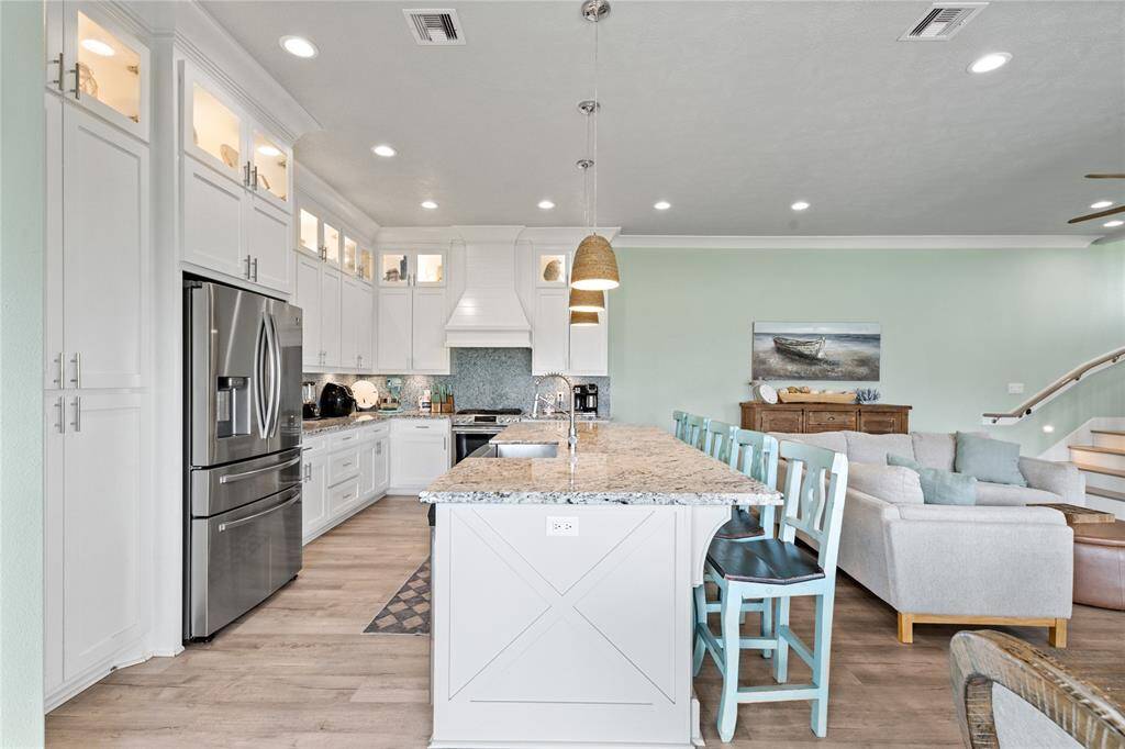 With its spacious layout, oversized island, and seamless flow into the dining and living areas, this kitchen is perfect for hosting. Whether it’s a casual brunch or an evening gathering, this space is made for making memories.