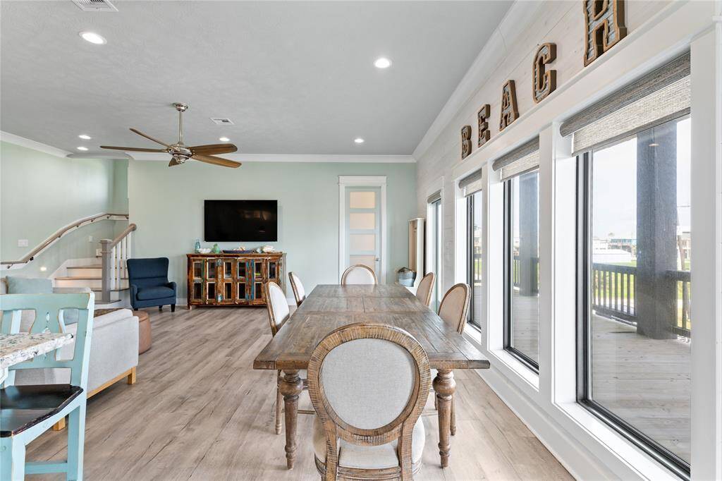 The spacious dining area is perfectly positioned to take in breathtaking views through huge windows that flood the space with natural light. Whether it’s a cozy family breakfast or a lively dinner with guests, every meal feels special in this stunning coastal setting.