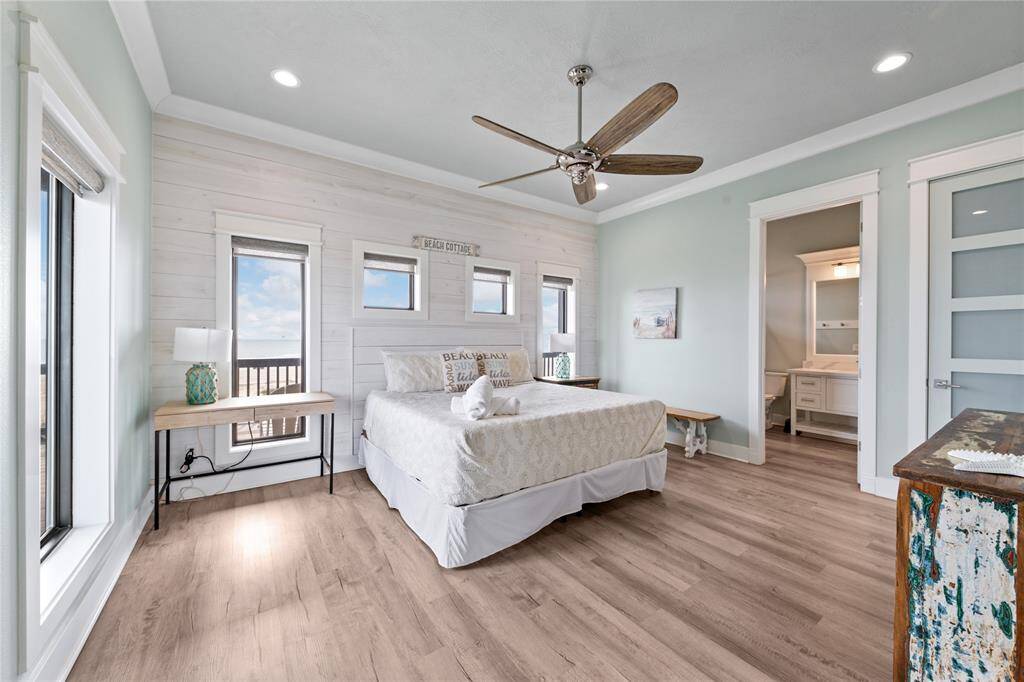 Wake up to breathtaking ocean views in this stunning downstairs primary suite. With large windows framing the coastline, this private retreat offers the perfect blend of comfort and luxury.