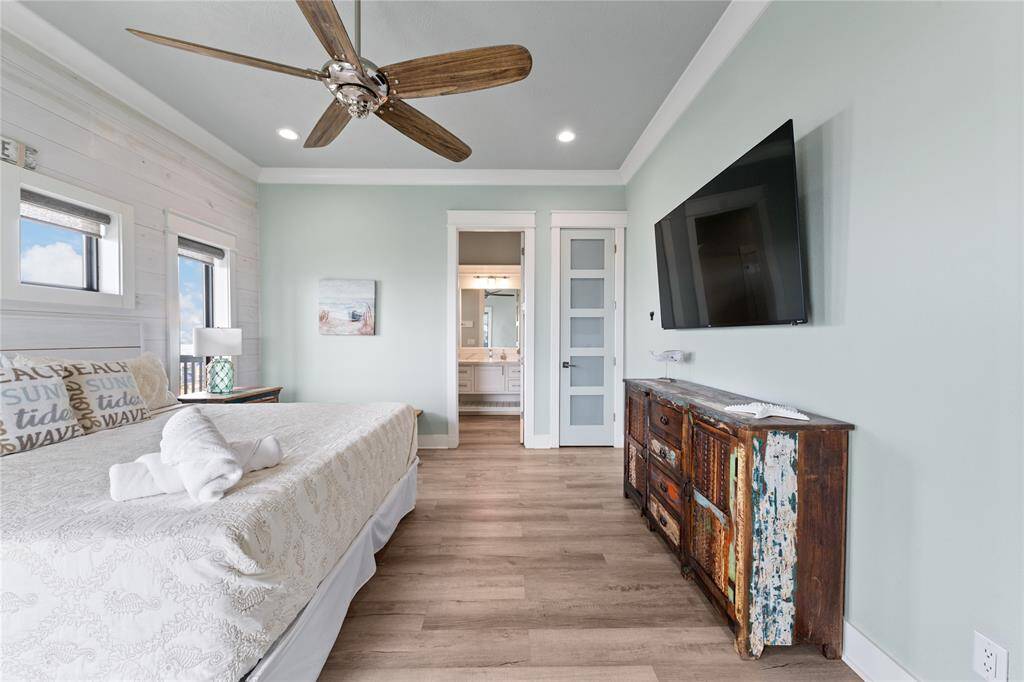 Enjoy panoramic beach views right from your bed in this beautifully designed primary suite. With high-end finishes and an open, airy feel, this space is the ultimate coastal retreat.