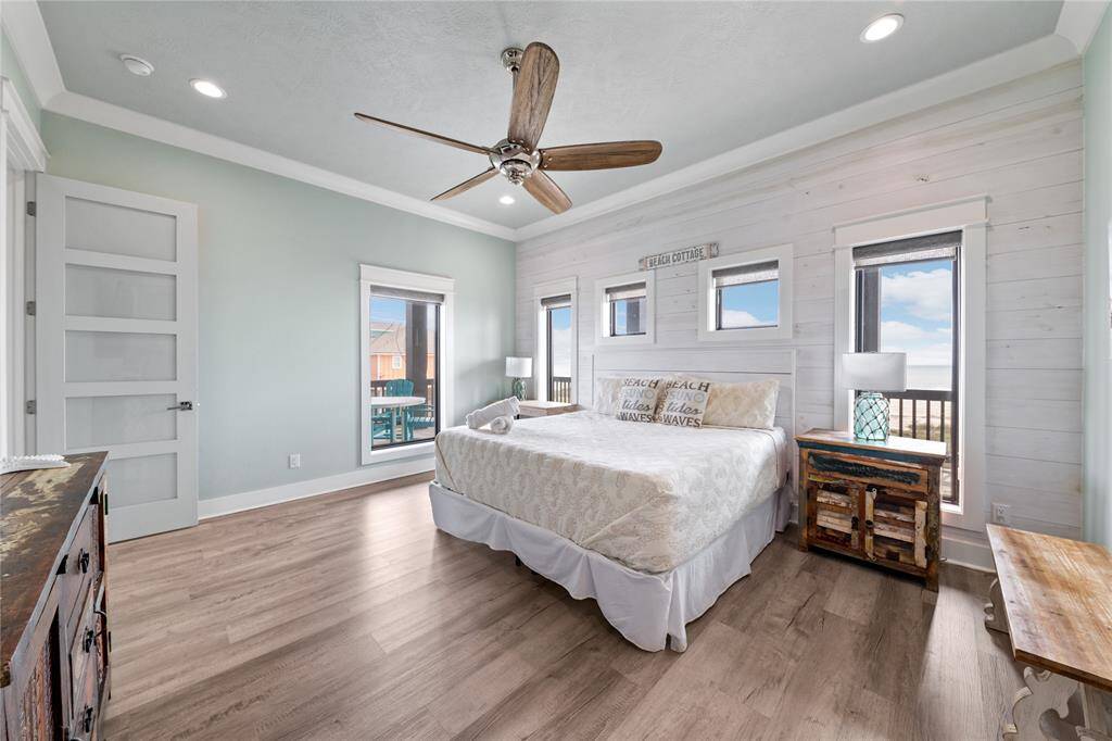 This downstairs primary bedroom combines modern design, soothing coastal tones, and stunning beach views. Spacious yet cozy, it’s a peaceful haven for unwinding and recharging.