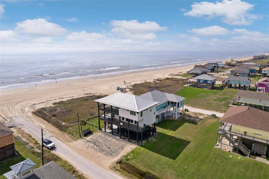 With direct beach access just moments away, this home is perfect for days filled with sun, surf, and sand. After a fun-filled beach day, rinse off in the downstairs outdoor shower before heading inside to relax in your modern, coastal-inspired retreat.