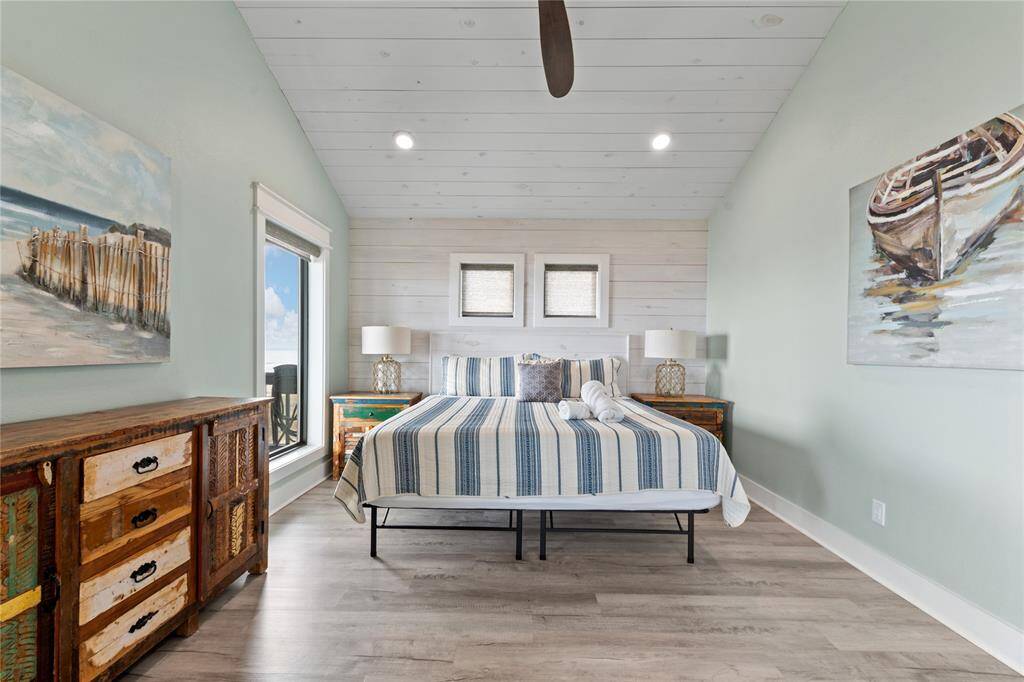 The upstairs primary suite boasts a spacious bathroom with a huge walk-in shower equipped with dual rain shower heads—perfect for a refreshing, spa-like experience. Step out to your private wraparound deck to soak in the breathtaking ocean views.