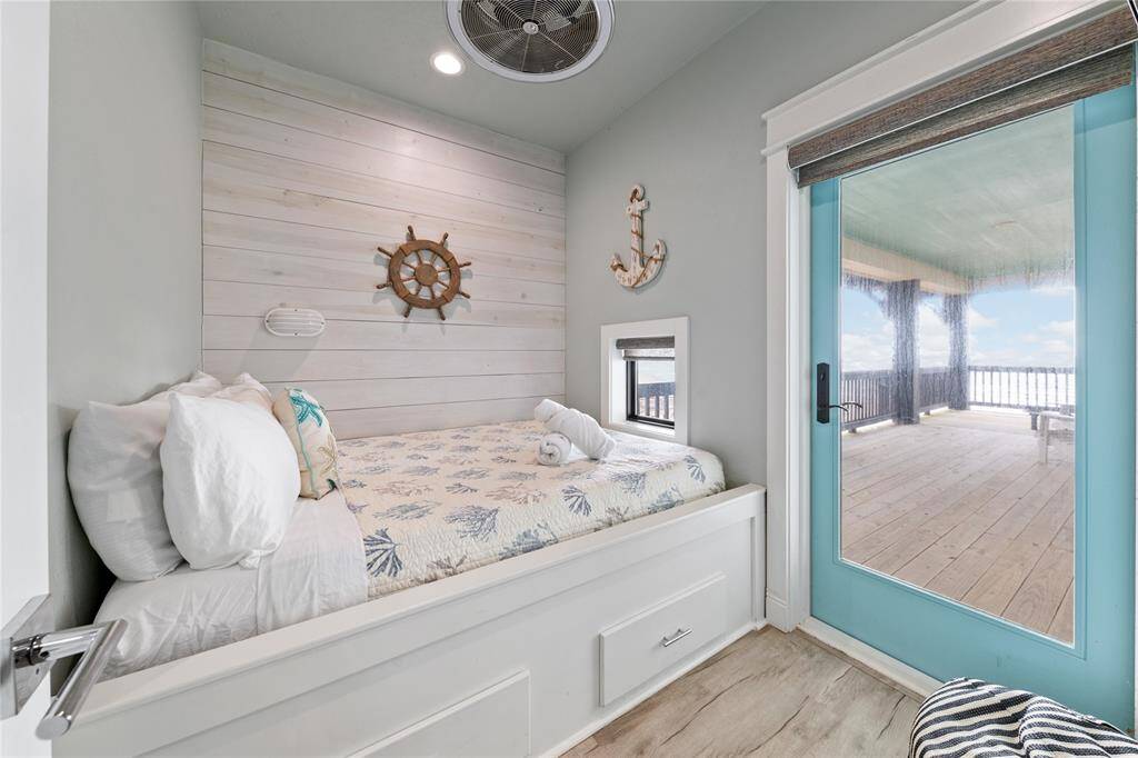This charming bonus room features a built-in bed, perfect for cozying up or hosting guests. With private access to a secluded deck, it offers a peaceful retreat where you can unwind and enjoy the outdoors in complete privacy.