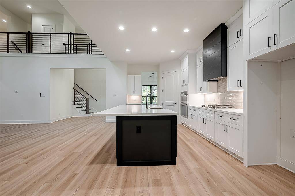 Storage space will not be an issue with a walk-in pantry along with cabinetry all along the kitchen and in the island as well