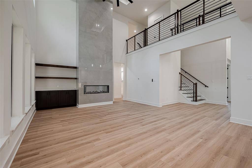 No expenses were spared on the fireplace with tile that scales to the ceiling!