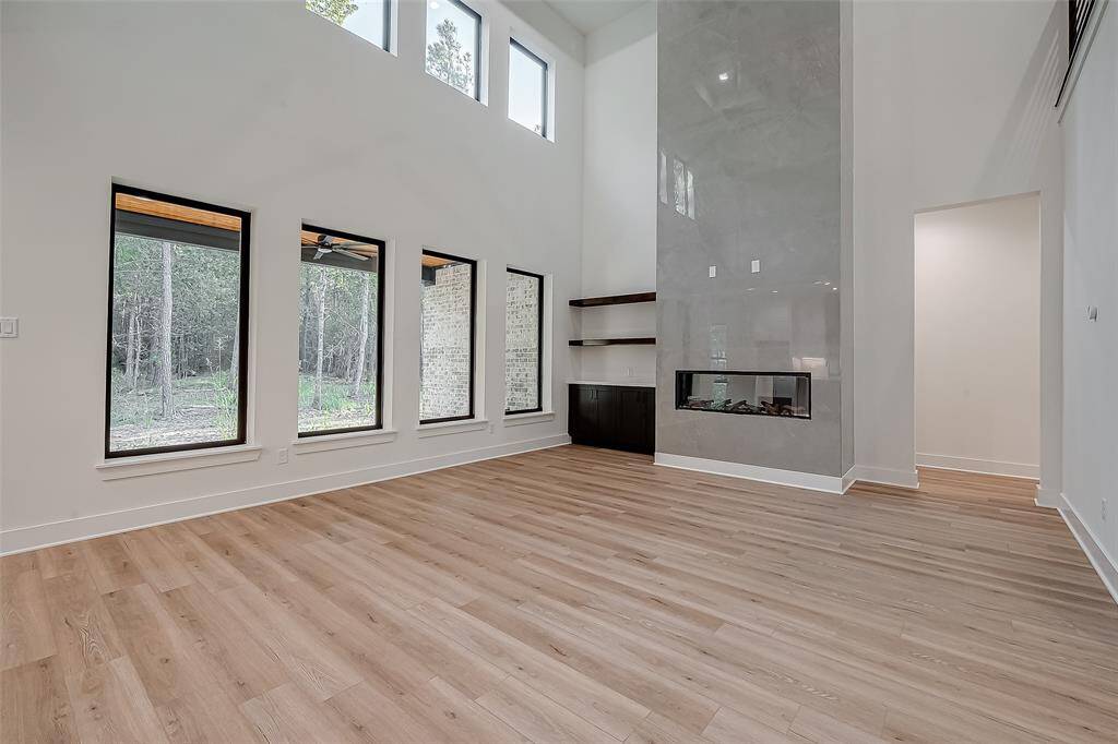 Living room with high ceilings and windows that provide an abundance of natural light