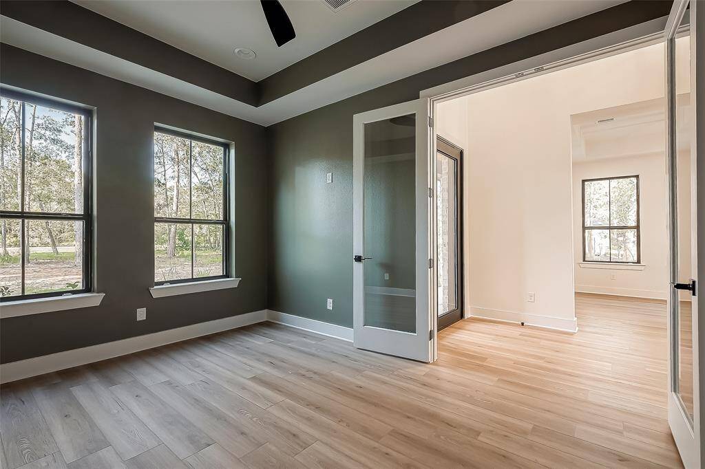 Office/study with French Doors and vaulted ceilings overlooking the front yard