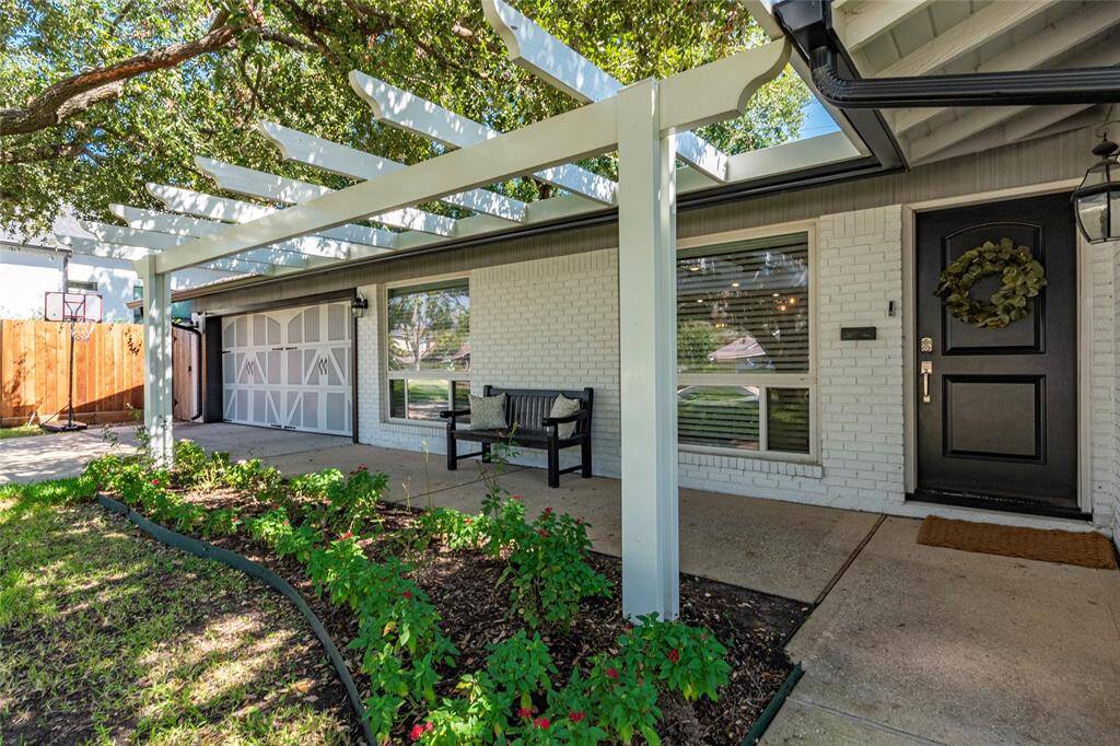 Charming single-story home with a welcoming facade, featuring a large, shady tree in the front yard. A curved walkway leads to the entrance, surrounded by a well-maintained lawn and landscaping. Ideal for buyers seeking a cozy, inviting property.