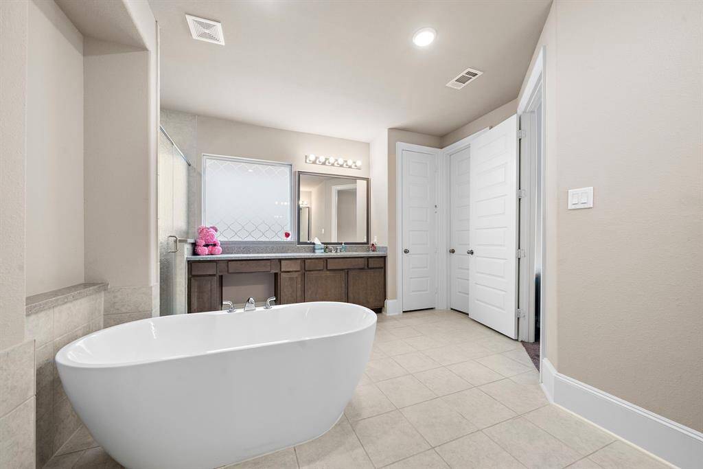 Primary ensuite bathroom located on first level