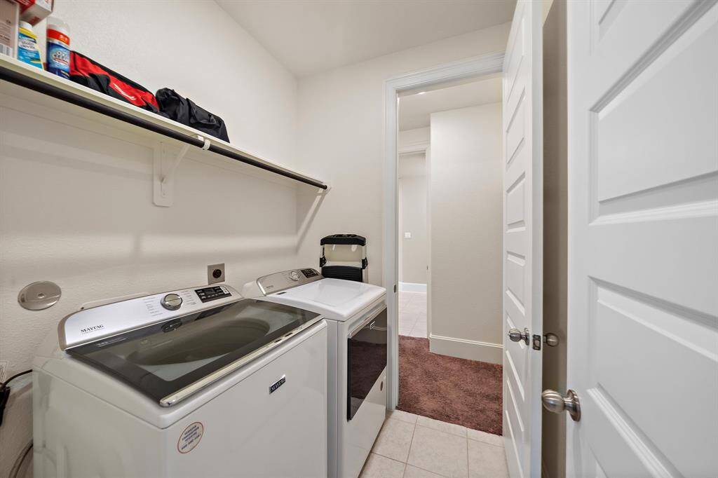 Laundry room and shelving first level
