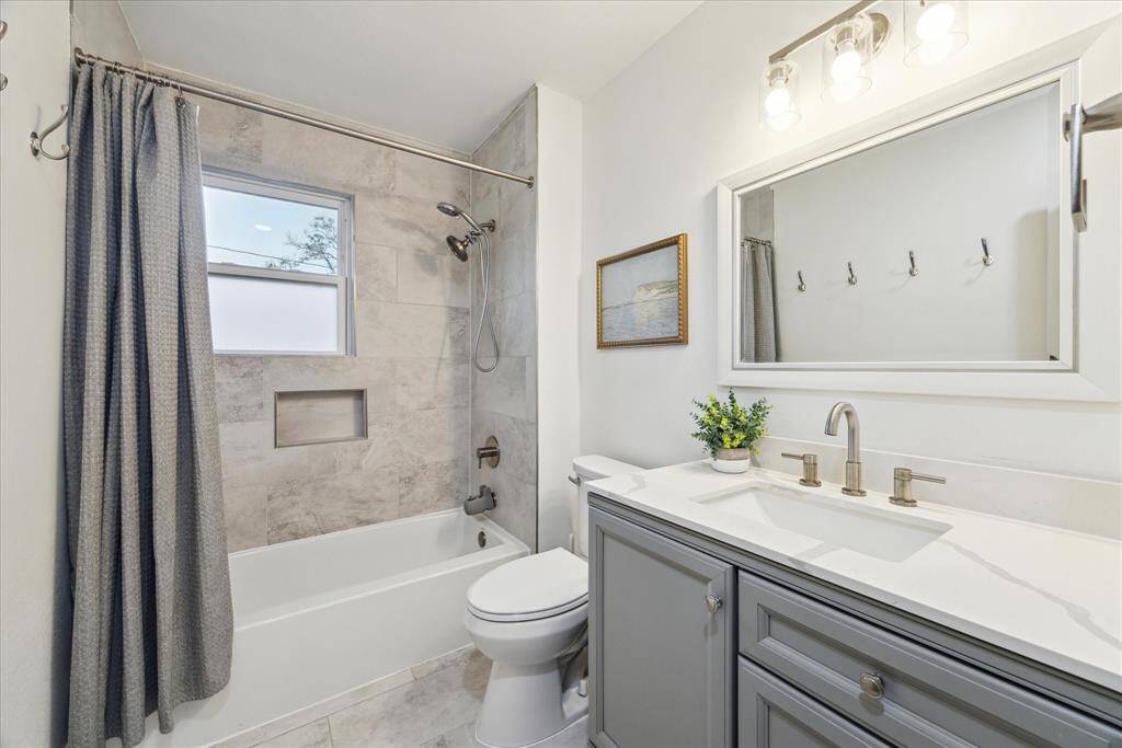 The second full bath is conveniently located between the primary bedroom & the second secondary bedroom.