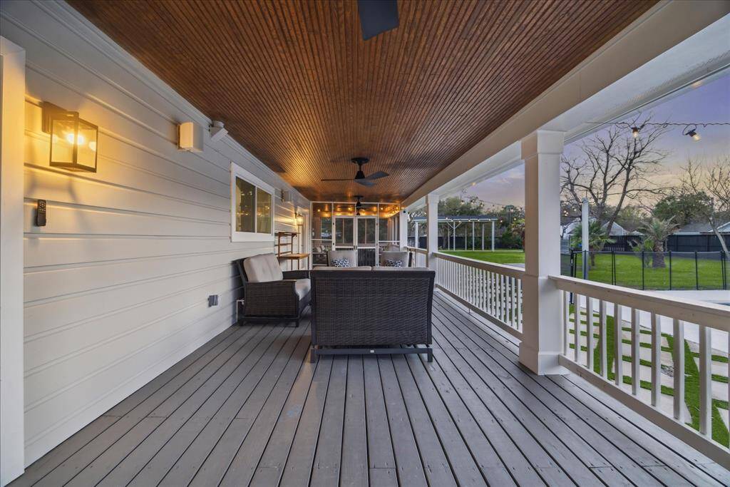 4 updated patio fans, with outdoor speakers and lovely stained beadboard ceiling on both porches