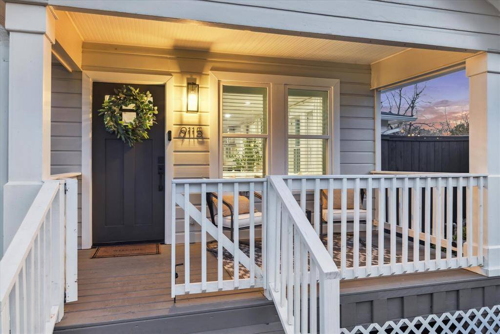New front door + updated front porch w/ added railings.