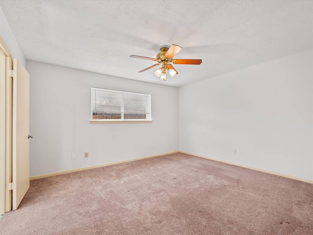 The primary bedroom is on the first floor and features an en suite bathroom and walk-in closet.