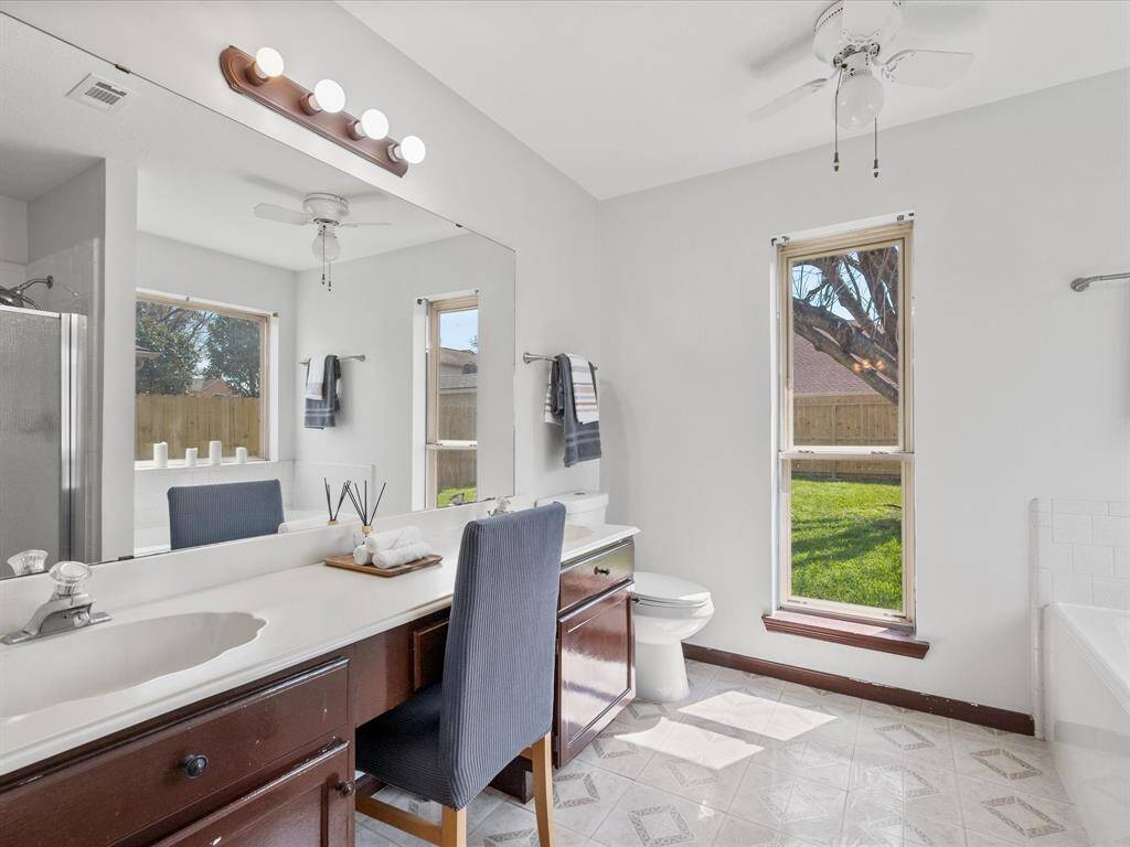 Primary bathroom with dual sinks.