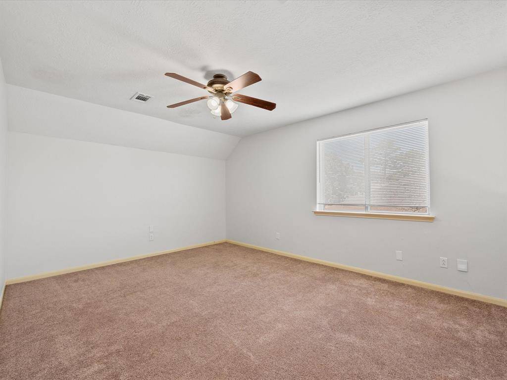 This versatile loft space can be used as a game room or office space.