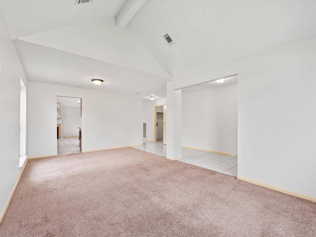 The dining space connects to the kitchen and second living space.