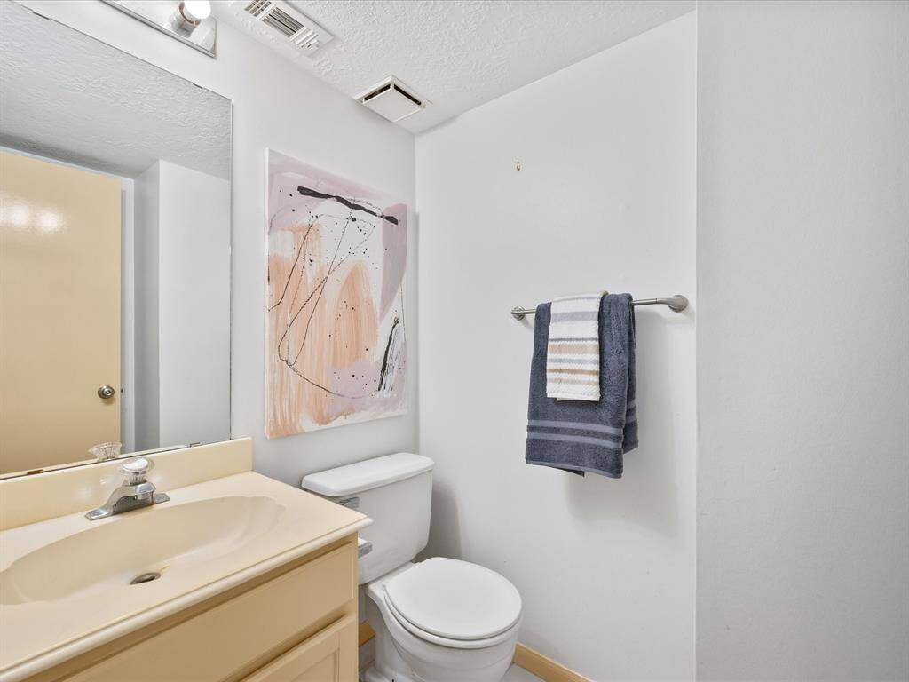 The half bathroom is off the second living space.